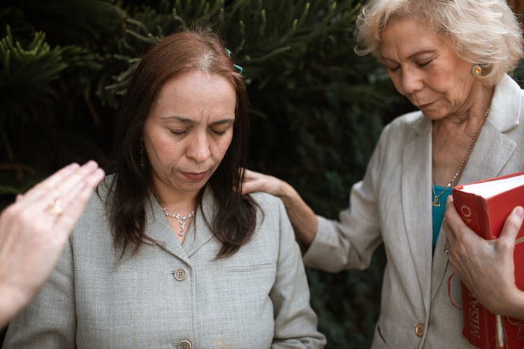 Women Praying With Eyes Closed