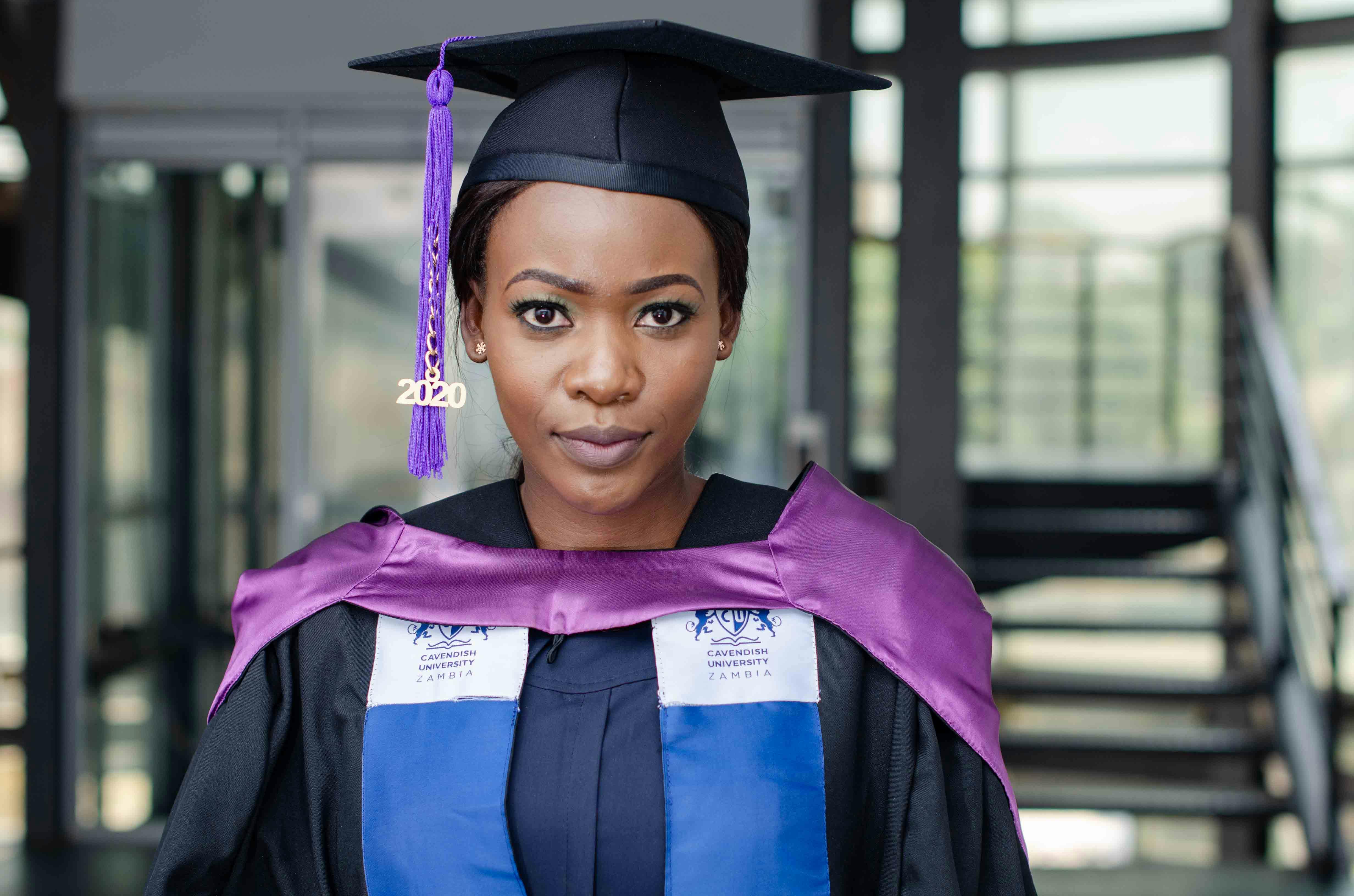 portrait of a woman wearing a graduation cap