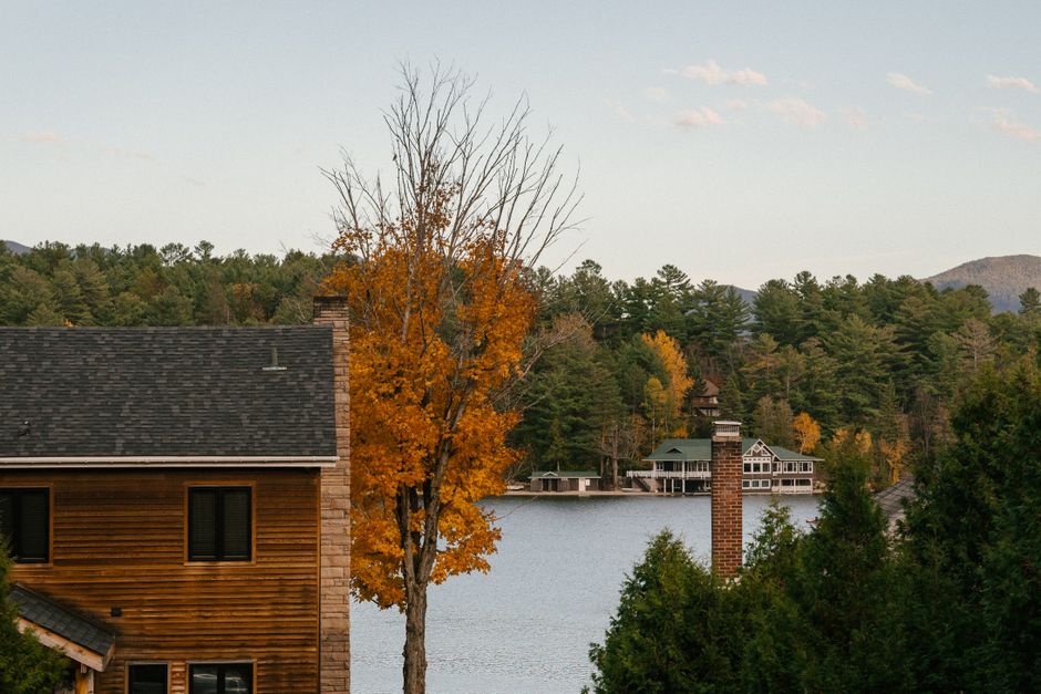 Wooden lake cottages surrounded by autumn woods in Harbor Country, Michigan — Broomsmen handles Saturday changeovers and seasonal open and close cleans