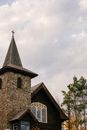 From below exterior of aged stone St Eustace Episcopal Church located in Lake Placid on cloudy autumn day