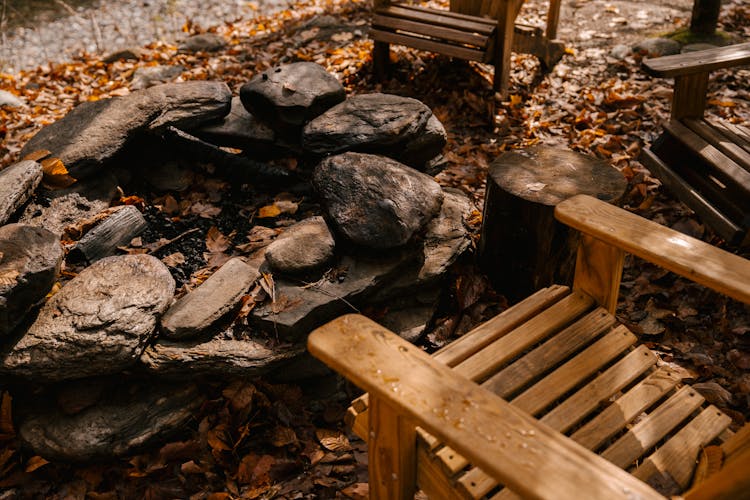 Wooden Chairs Near Place For Fire