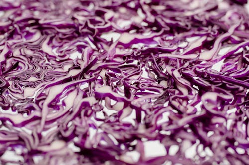 Close-Up Shot of Red Cabbage on a White Surface