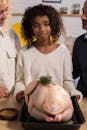 Black girl in kitchen with crop parents