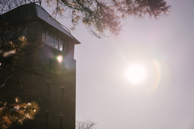 High Tower Against Cloudless Sky With Bright Sunshine