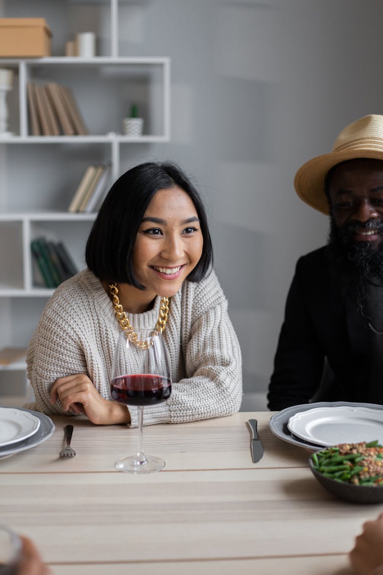 Multiracial Couple Having Dinner With Guests