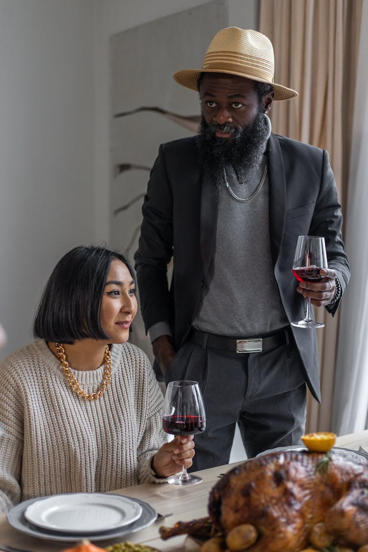 Diverse Couple With Glasses Of Wine