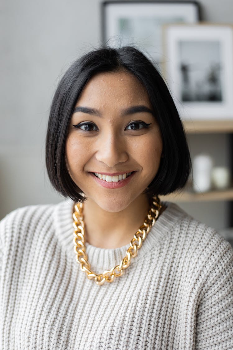 Smiling Ethnic Woman With Golden Chain Looking At Camera