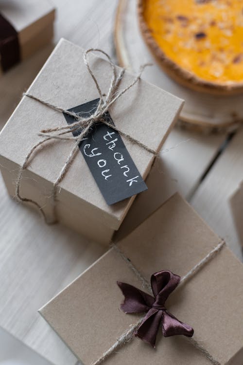 Gift boxes on table tied with ropes