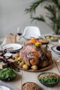 Wooden table served with tasty dishes on Thanksgiving Day