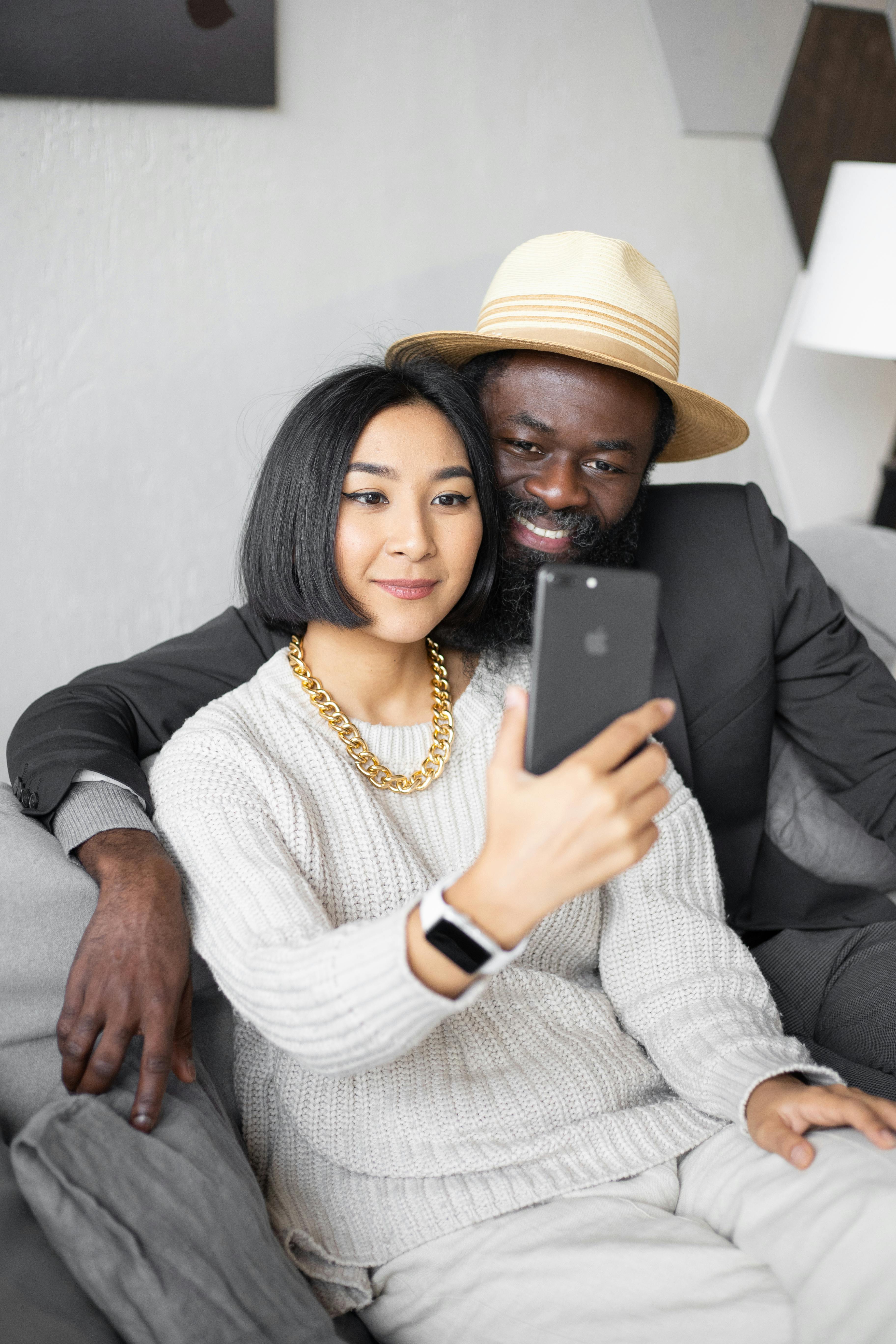 delighted diverse couple having video call with child