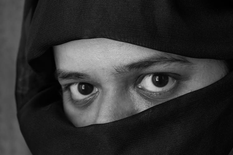 Grayscale Photo Of A Person Wearing Hijab