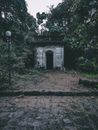 Small shabby stone outbuilding in park