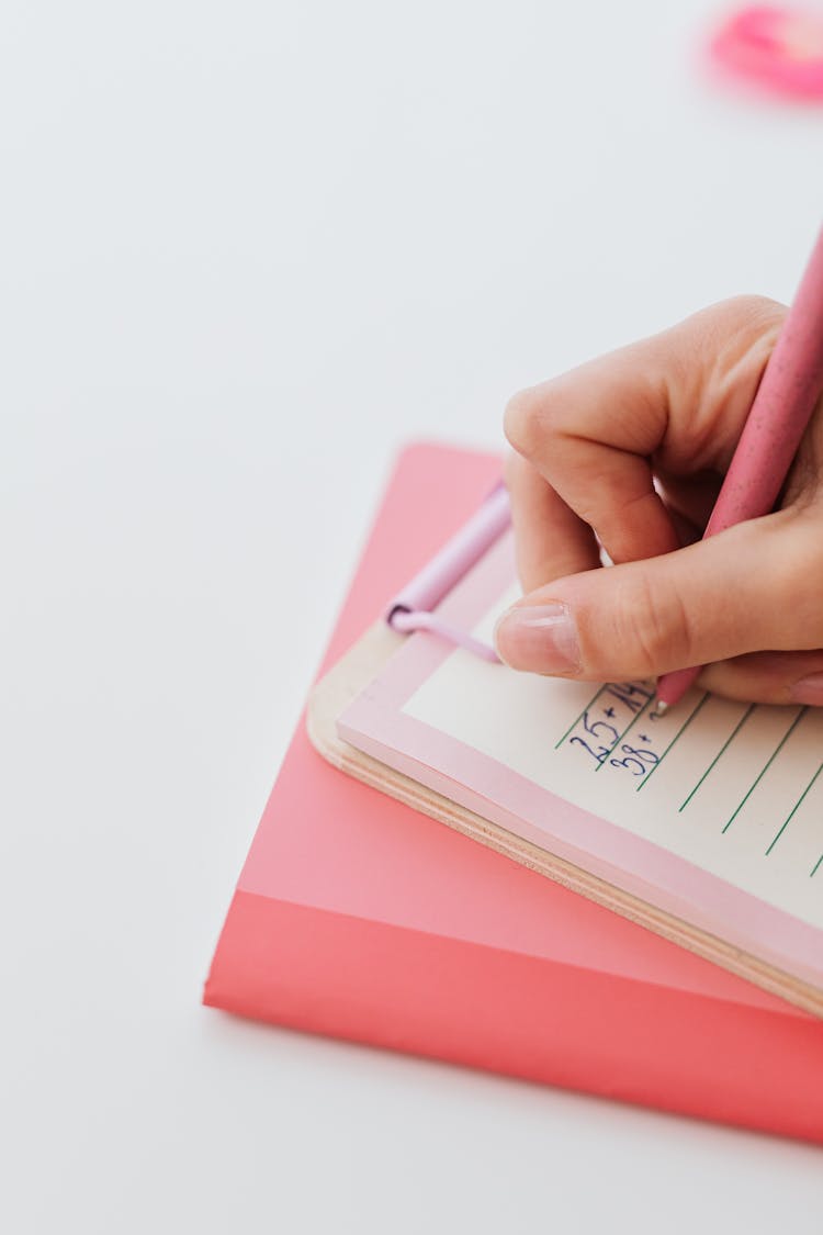 Woman Writing On Paper