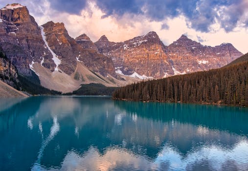 Breathtaking view of Lake Louise reflecting the Canadian Rockies at sunset.