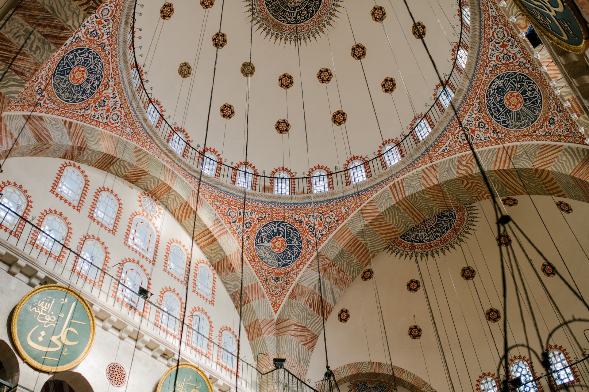 Intricate frescoes and architecture of Kılıç Ali Pasha Mosque in Istanbul, showcasing Ottoman style.