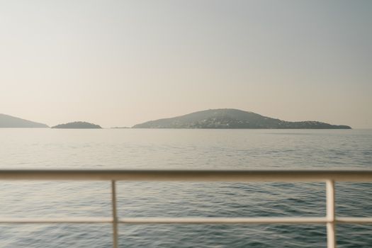 Serene seascape showing islands in Istanbul viewed from a boat, ideal for travel or tranquility themes.