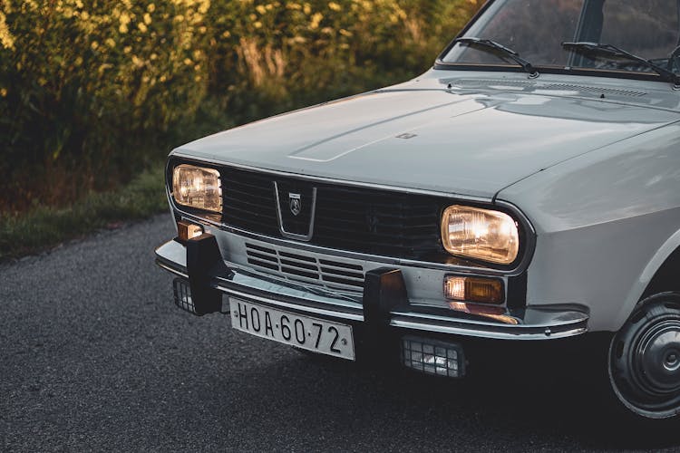 White Dacia 1300 Car On Gray Concrete Road