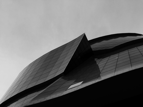 Free A striking monochrome view of a modern glass building in Winnipeg, Canada. Stock Photo