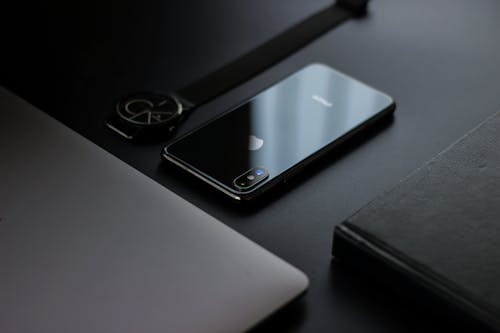 Black Iphone X on Black Surface 