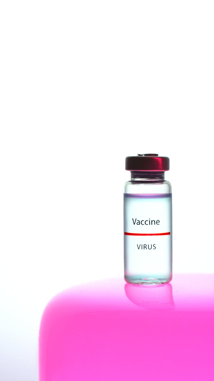 A Vaccine Vial On White Background