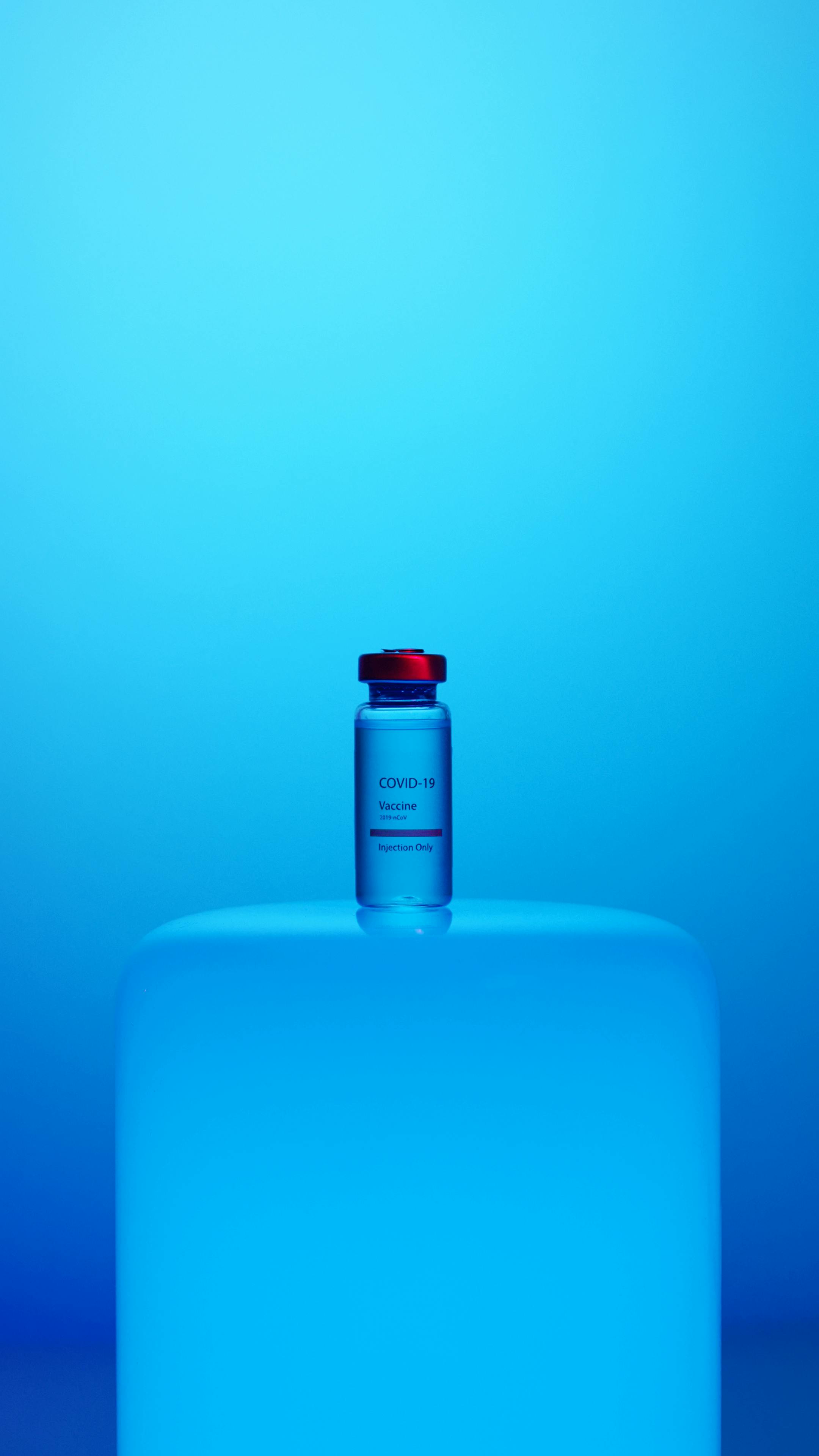 a vaccine vial on blue background