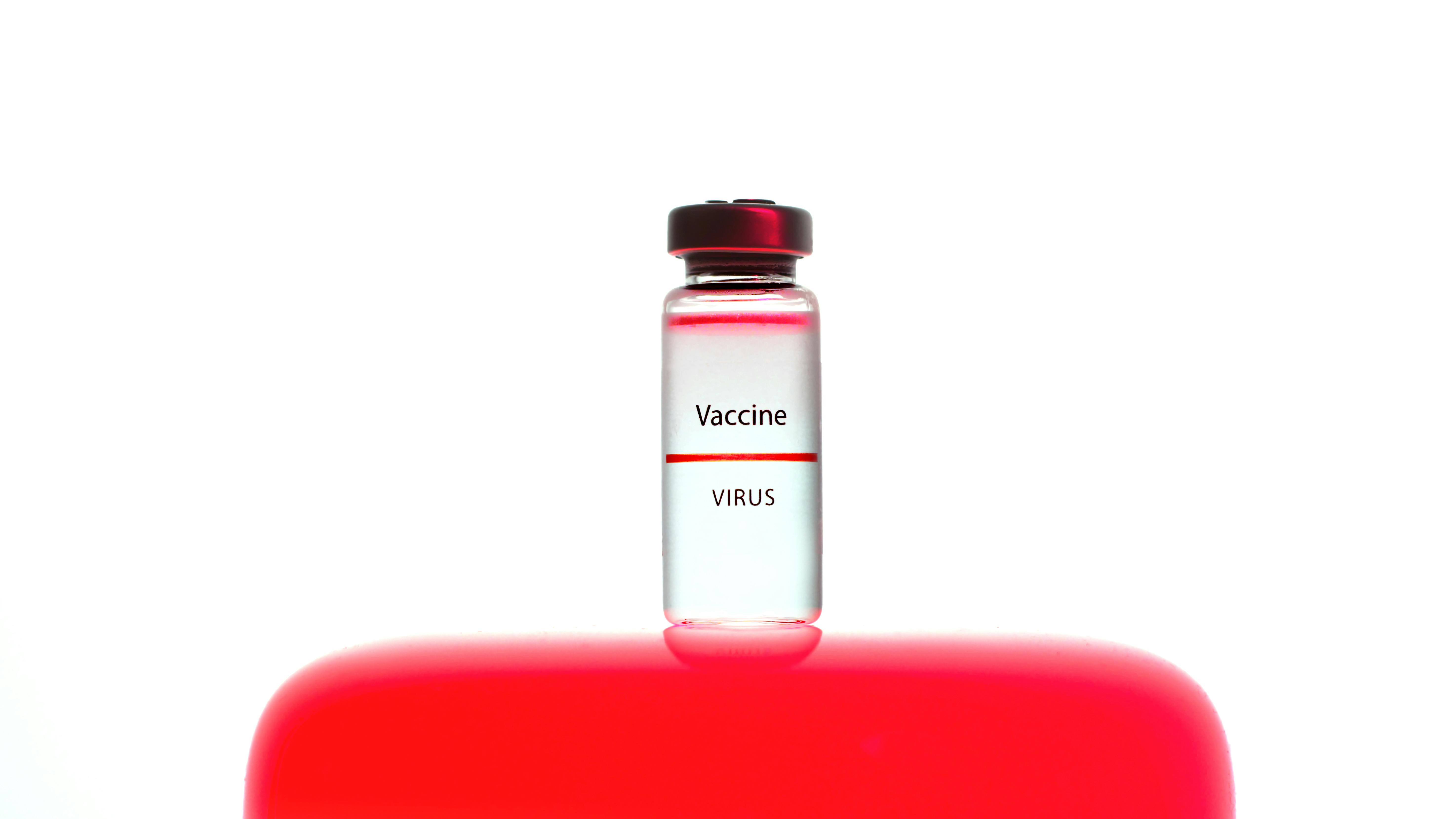 a close up view of a vaccine vial on white background