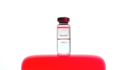 Free A Close-Up View of a Vaccine Vial on White Background Stock Photo