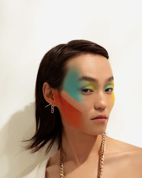 Woman with colourful makeup and accessories