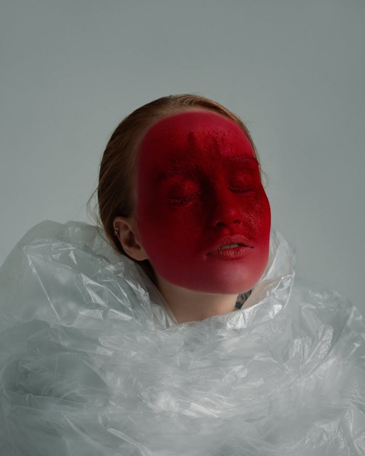 Mindful Model With Red Face On Gray Background