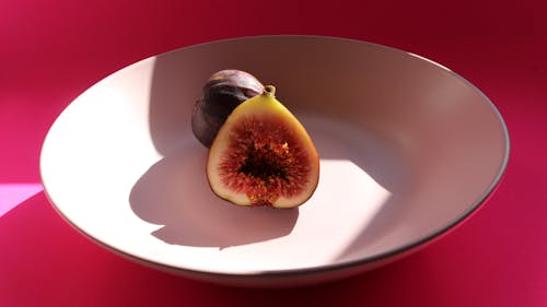 Sliced Fig on White Ceramic Bowl 