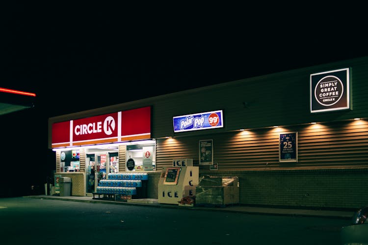 Convenience Store Building Facade With Signboards In Night City