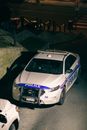Police car on road in night town
