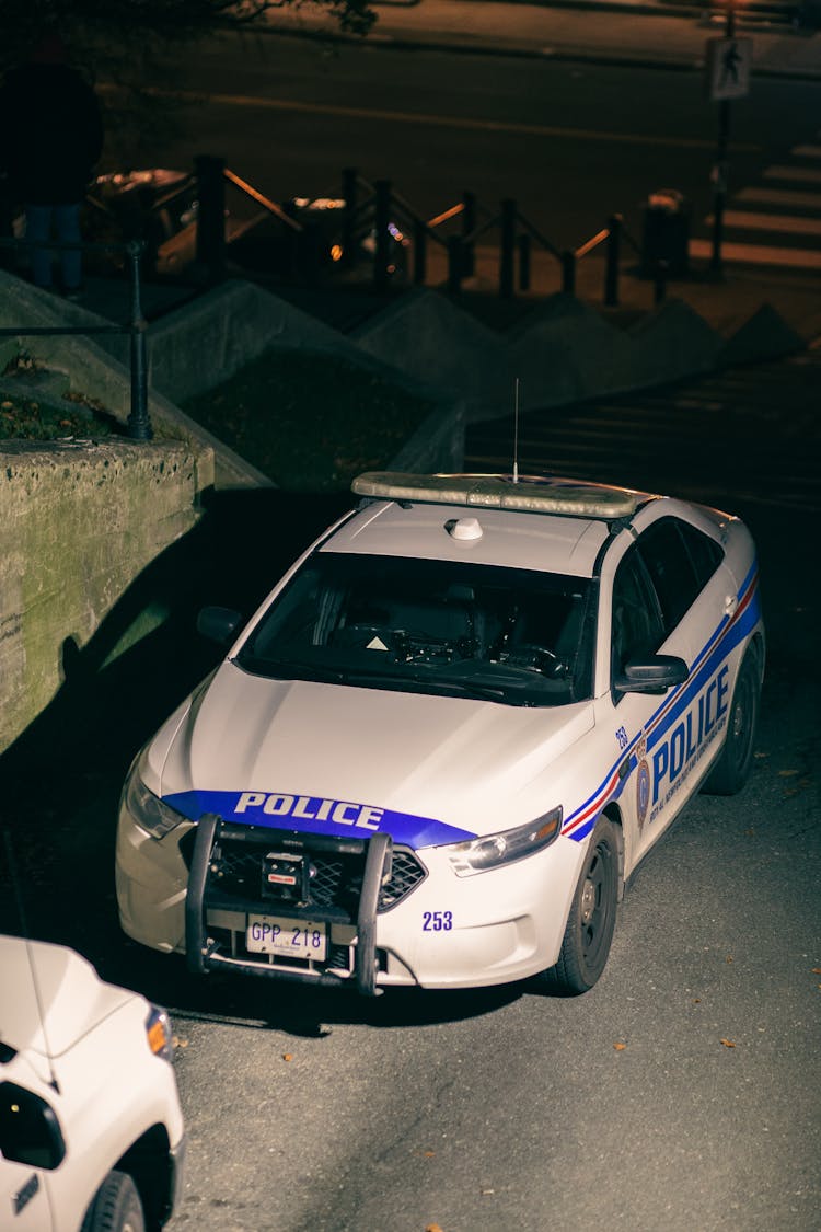 Police Car On Road In Night Town