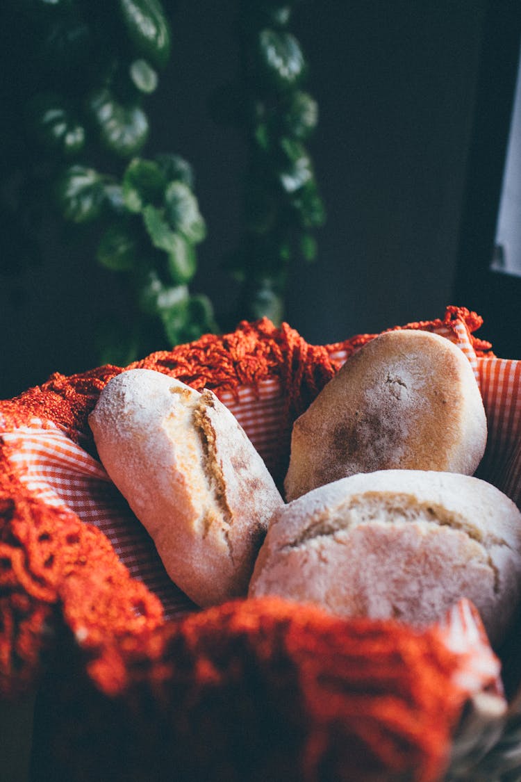 Brown Breads On Orange Gingham Fabric 