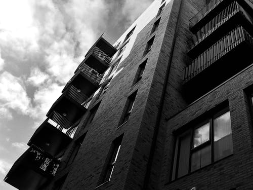 Grayscale and Low Angle Photography of High-rise Building