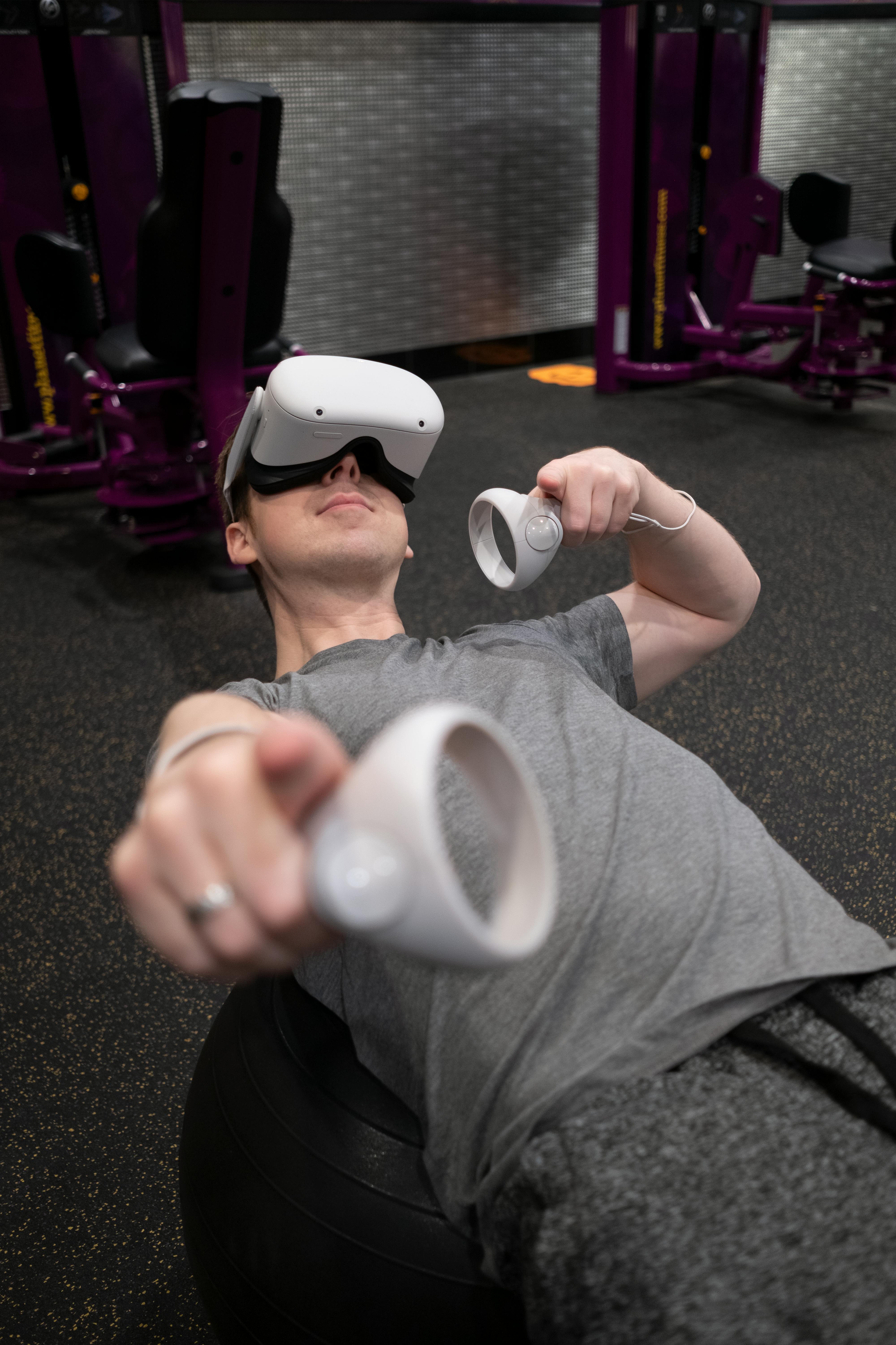 A Man Lifting Dumbbell while Wearing Virtual Goggles · Free Stock