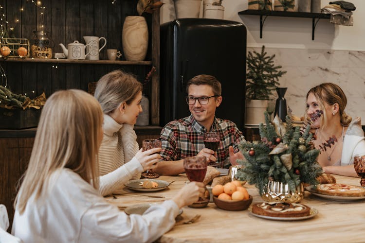 Man And Women Eating At Table