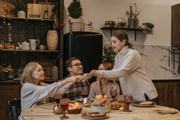 Friends Eating At The Table