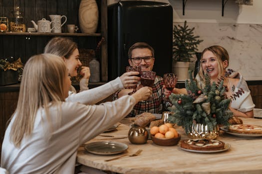 Friends enjoying a festive indoor gathering, toasting and celebrating together around a dining table.