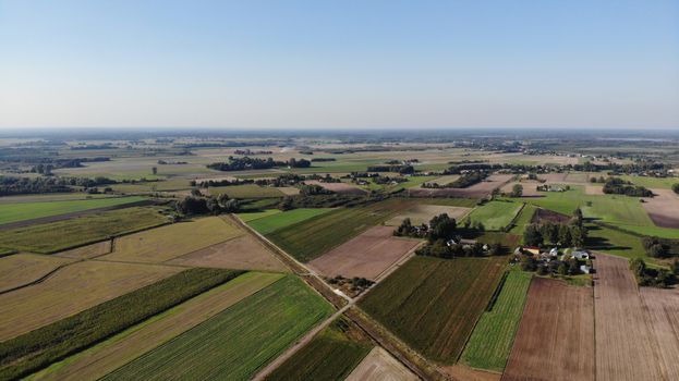 Expansive farmland landscape in Nadrybie Ukazowe, Poland captured from above.
