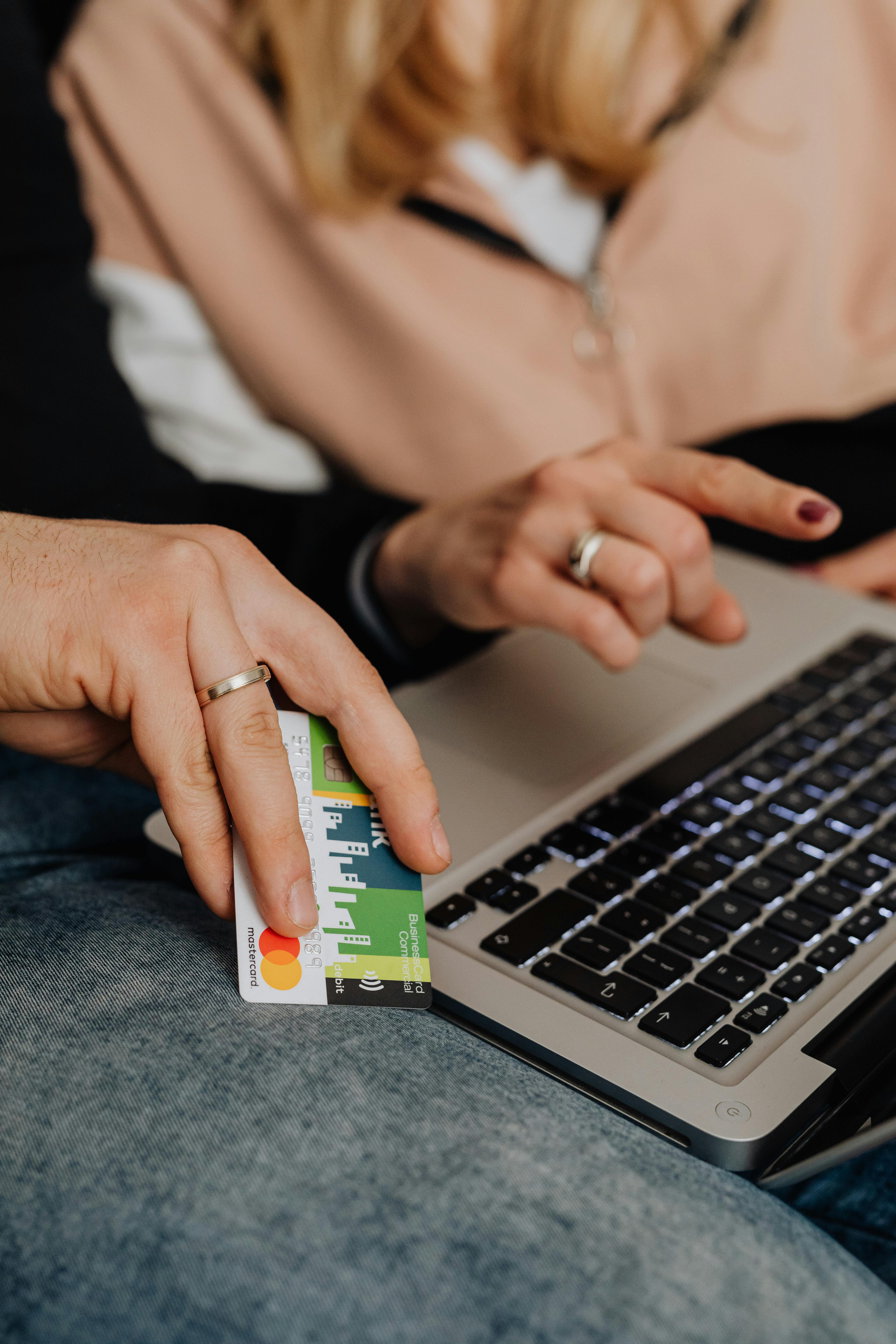 a person holding a bank card