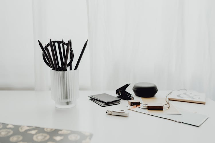 Pens In Cup On Desk