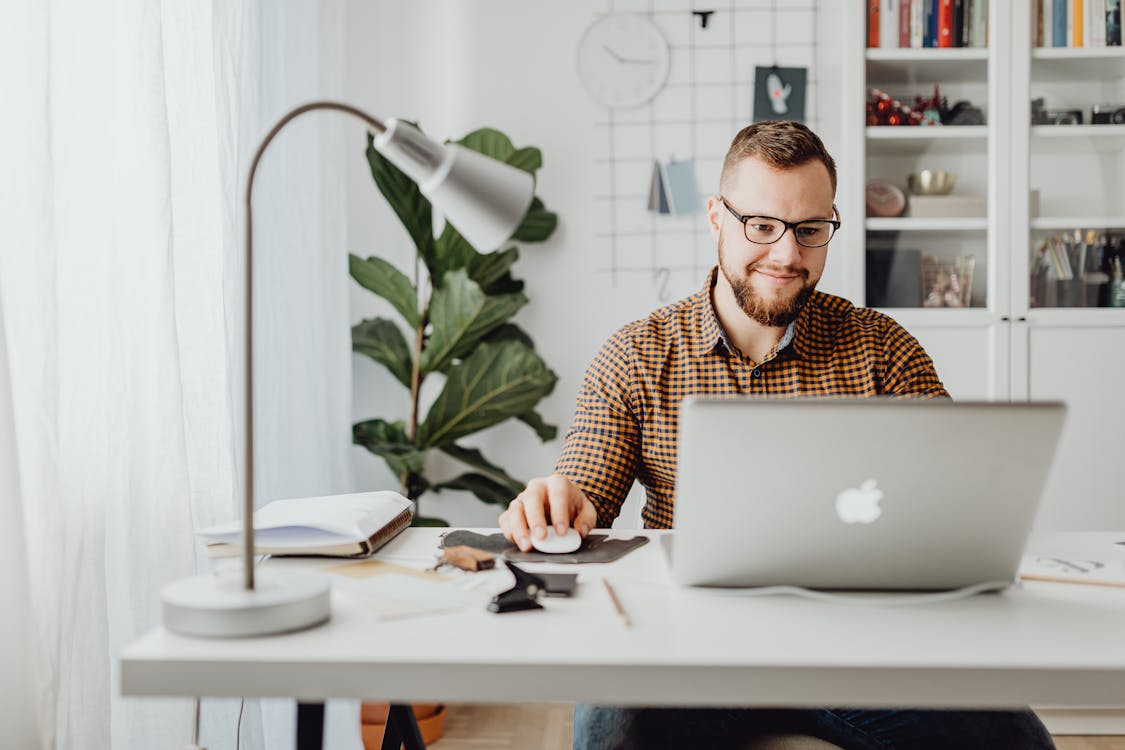 Free Man Using Macbook Stock Photo