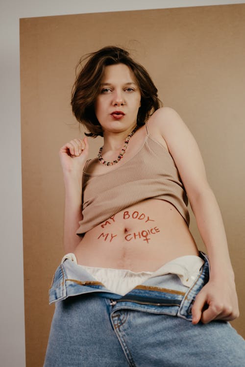 Free Woman with Message on Tummy  Stock Photo
