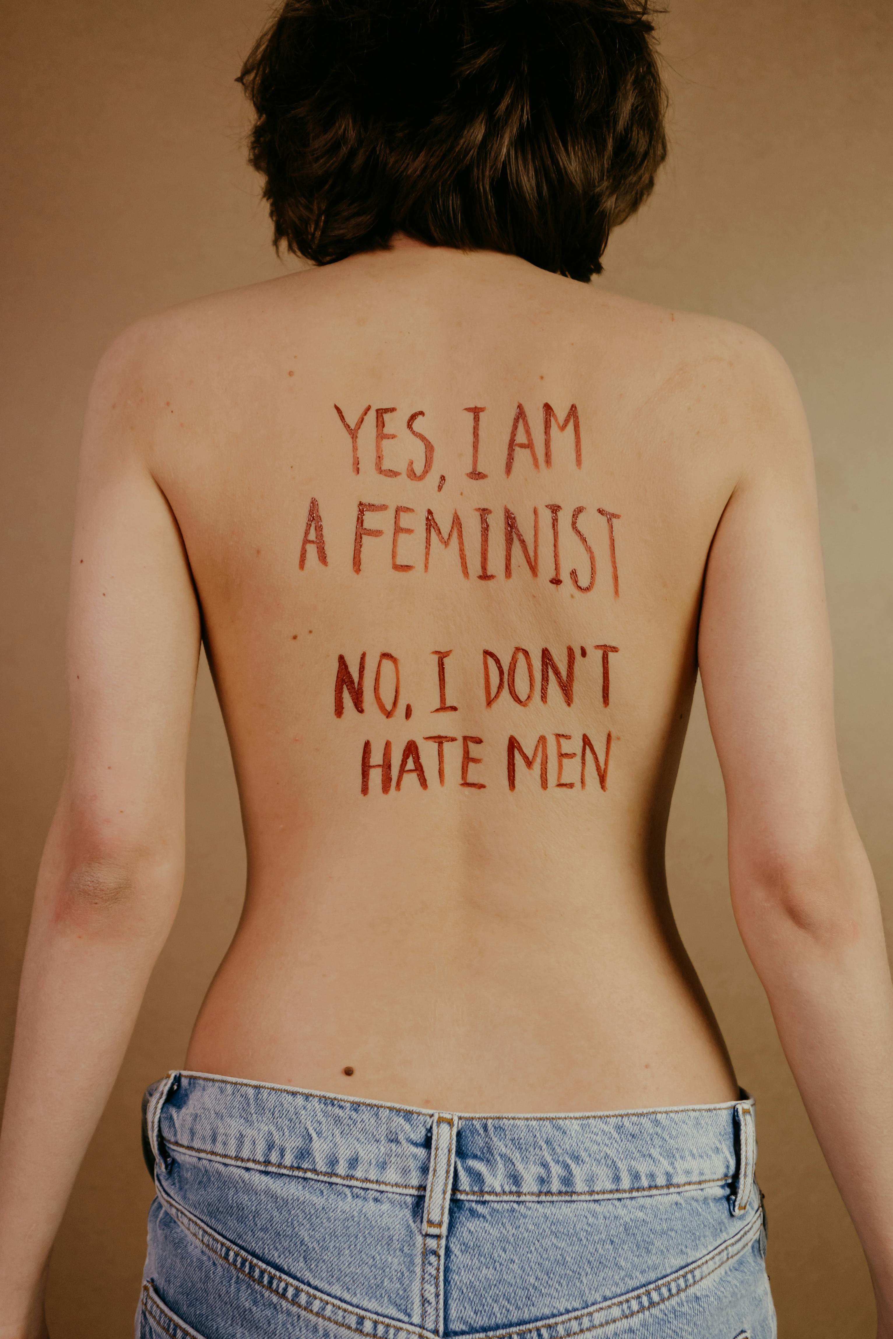 back of woman with message in red lipstick