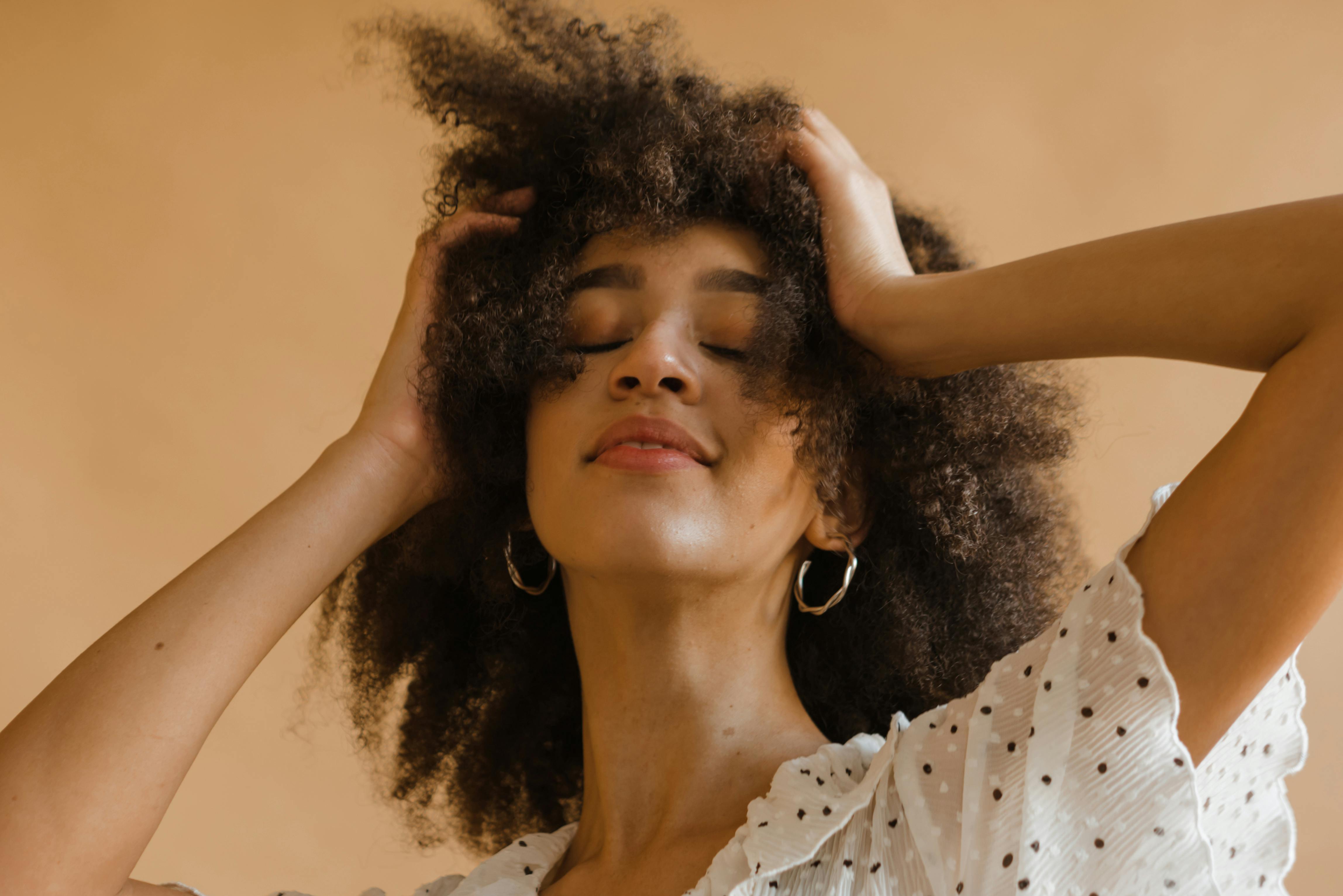 Free Woman in White and Black Polka Dot Shirt Stock Photo