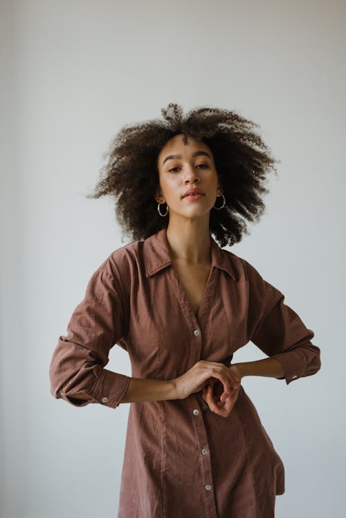 Woman in Brown Long Sleeve Dress