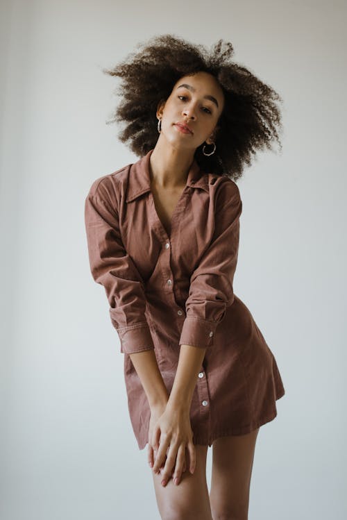 Woman in Brown Long Sleeve Dress