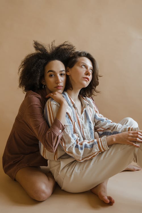 Free Woman in Brown Long Sleeve Shirt Beside Woman in Brown Long Sleeve Shirt Stock Photo