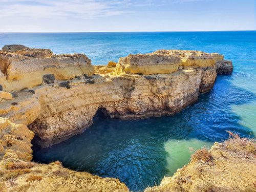 Free Explore the breathtaking cliffs and crystal-clear waters of Algarve, Portugal's scenic coast. Stock Photo